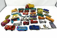Overhead view of 43 die-cast vehicles arranged on white background