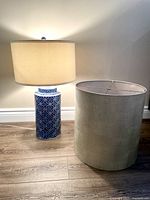 Lamp and extra drum shade side by side to show both items and scale