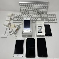 All items overview: five iPhones, two keyboards, four charger blocks, assorted cables
