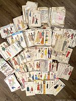Overview of large spread of mixed sewing patterns on floor