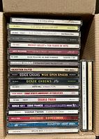 Stacked view of entire group of CDs showing spines for title identification