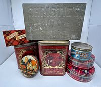 Group shot of all eight tins displayed together