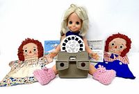 Group shot of Velvet doll, View-Master viewer, two puppets and reels