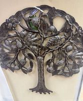 Front view of entire silver metal tree and bird wall art