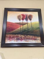 Front view of framed canvas landscape painting