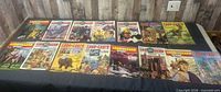 Sixteen Look and Learn and Look and Learn plus Speed magazines laid out on table