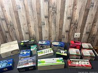 All boxed lighting items arranged on table