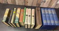 All 12 hardcover volumes standing spine-out