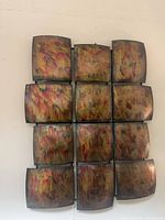 Front view showing full 3 x 4 grid of iridescent metal squares