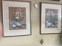 Both framed prints hanging side by side showing overall appearance