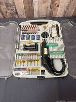 Full kit open showing rotary tool, case, and wide range of accessories