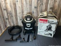 Group shot of vacuum, hose, attachments, box