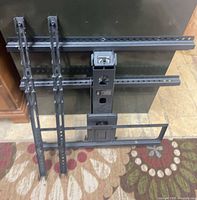 Front view showing full bracket with vertical and horizontal rails