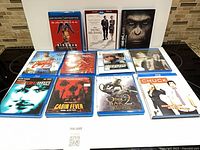 Front view of all 11 Blu-ray cases displayed on a stovetop
