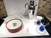 Full lot view showing shaker, six glasses and boxed plates