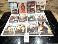 All 12 DVDs displayed together on stovetop