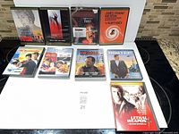 Nine DVD cases arranged, front artwork visible