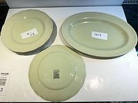 Platter and stack of six plates top view with size notes visible