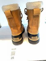 Rear view of both boots showing Sorel branding and shearling cuffs