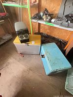 Two hard coolers with Koolatron electric cooler on top