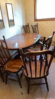 Dining table with chairs around it