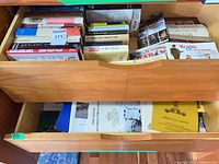 Open drawer showing two levels of military history books
