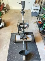 Full view of the electric golf trolley showing frame, wheels, handle, and basket