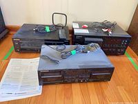 Three Pioneer components with manuals, remote, cables