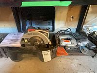 Circular saw, jig saw, angle grinder on shelf
