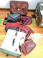 Group shot of all eight bags laid on floor