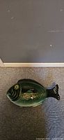 Overall view of green glazed fish-shaped 2-piece dish
