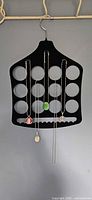 Organizer hanging with five necklaces displayed