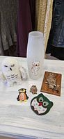 All six owl-themed items grouped on surface