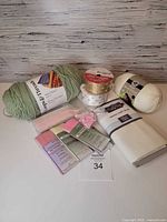 All items together including yarn, ribbon spools, bias tape packs, canvas fabric, clips