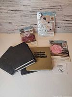 Lot overview showing three Bigz dies and three packaged David Tutera Framelits plus loose leaf die