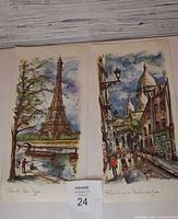 Both Arno Paris prints side by side on surface