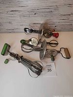 All four vintage hand mixers laid out together