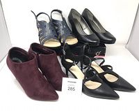 All four pairs of shoes displayed together