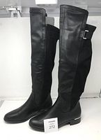 Both boots left side profile showing height, toe shape, heel detail