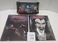 Lot overview showing two Ravenloft books and sealed Nano Metalfigs pack