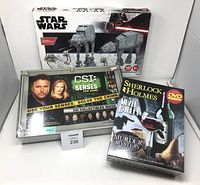All three boxed items: Sherlock Holmes game, CSI game, Star Wars kit