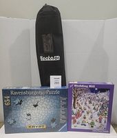 Group shot of Becko mat bag, Ravensburger Krypt puzzle box, Sledding Hill puzzle box