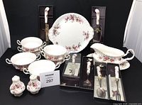 Full lot showing gravy boat, underplate, cake plate, four of six soup bowls, salt & pepper shakers, boxed serving pieces