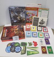 Group shot of sealed campaign box, books, card decks, templates and reference sheets