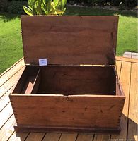 Chest with lid open showing interior and divider