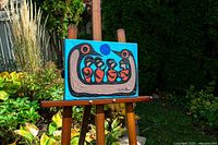 Painting on easel outdoors, full view of artwork and scale