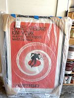 Full view of framed Vertigo poster wrapped in plastic