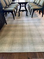 Full view of rug under dining table showing color and size