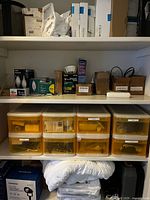 Shelf with Pentair box, Sunvie lights, Philips bulbs, yellow hardware drawers, miscellaneous boxed accessories