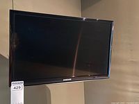 Front view of Samsung 24-inch TV mounted on wall